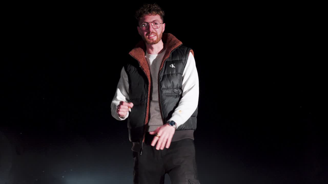 close-up shot of a man getting assaulted by a group of masked men with weapons