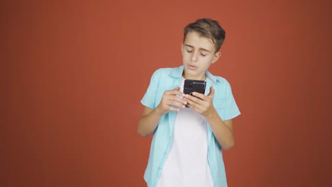 Dancing-boy-with-phone-in-hand.