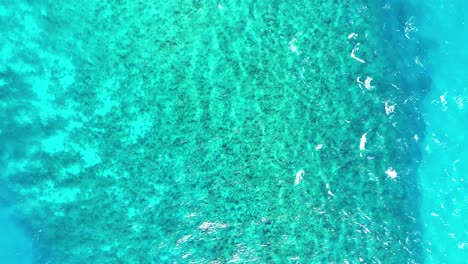 turquoise ocean waves near volcanic rock formations