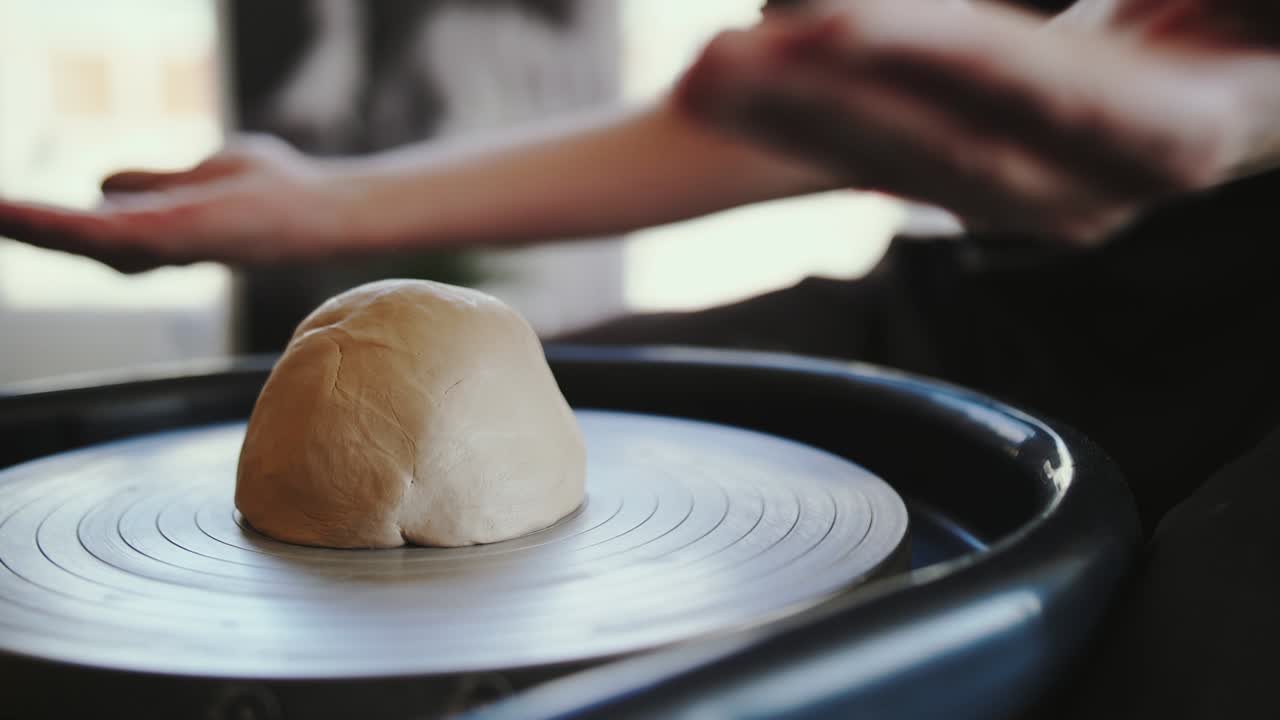 Potter's wheel potter works with his hands