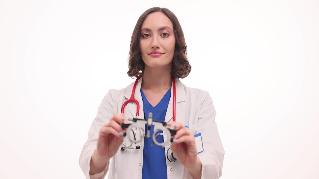 Female Doctor or Optometrist Holding a Phoropter