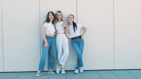 three friends posing outdoors