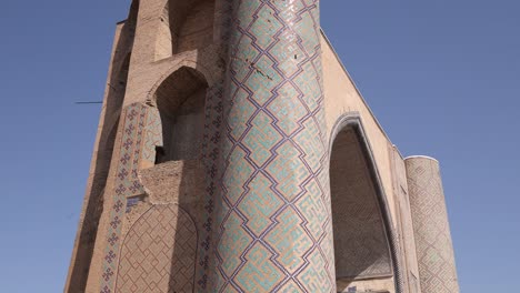 tall minarets with historic intricate tiling of a madrassa in samarkand, uzbekistan along the historic silk road