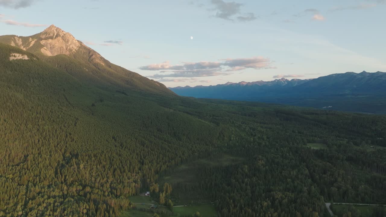 Aerial View Of Mountains Covered In Green Trees