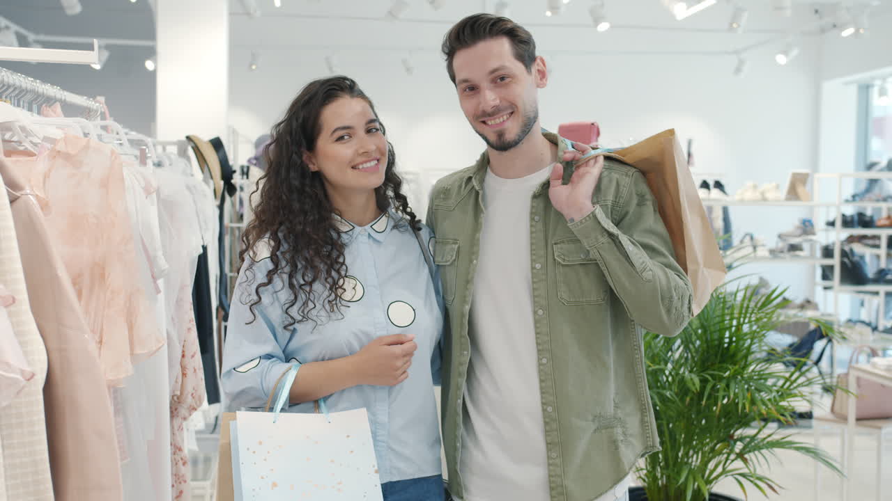 Happy Couple Shopping for Clothes