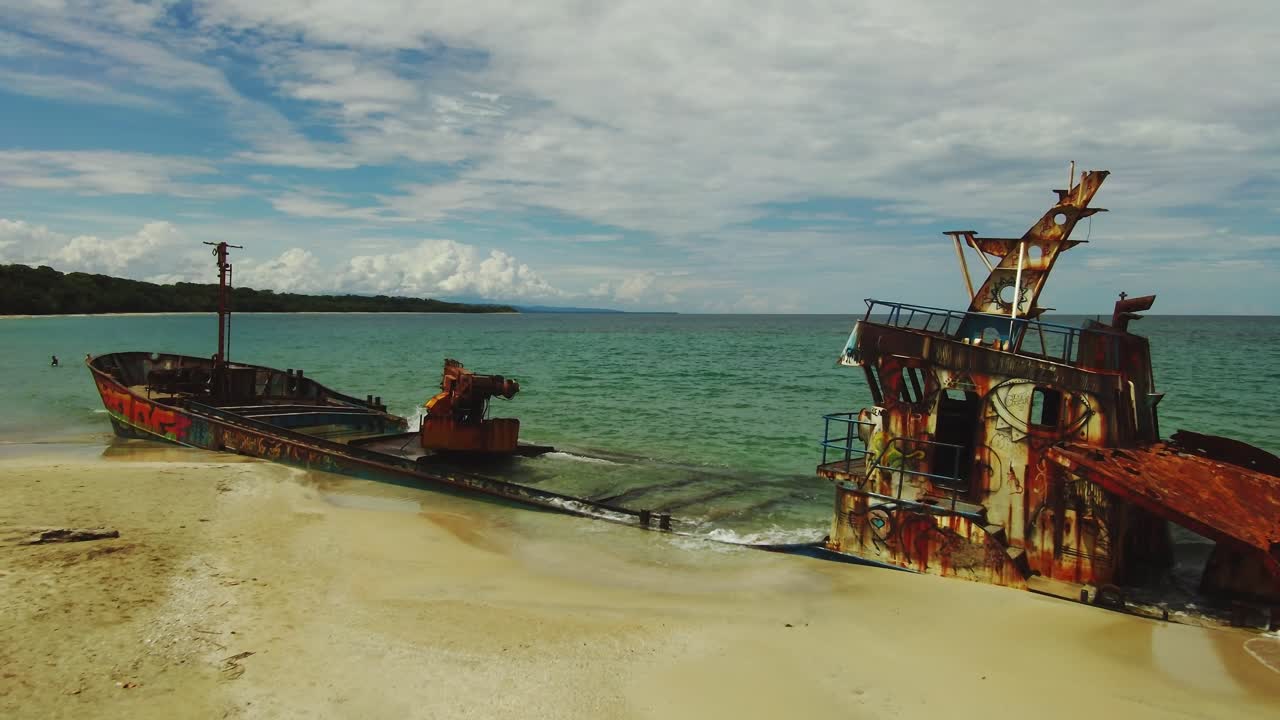 Manzanillo Beach Ship Wreck Drone Flyover Blue Ocean To Rusted Colorful Vessel, 4K Costa Rica