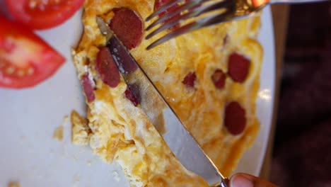 breakfast omelette with sausage and tomatoes