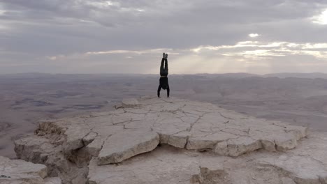 handstand on a desert mountaintop