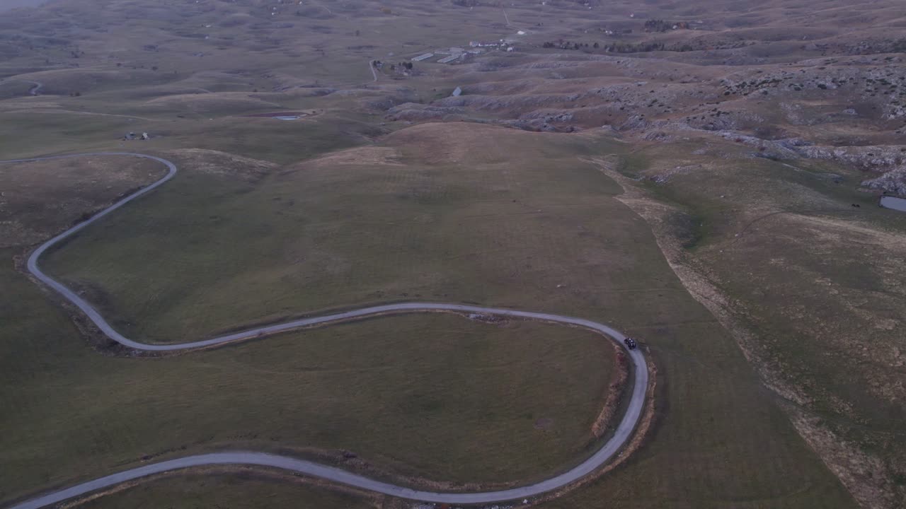Aerial view of winding road and camper in Durmitor National Park, Montenegro