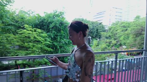 woman walking on a city bridge