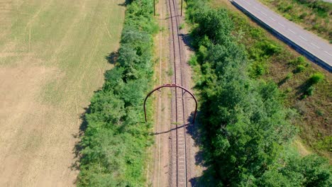 Railway leading through countryside of France, aerial drone view