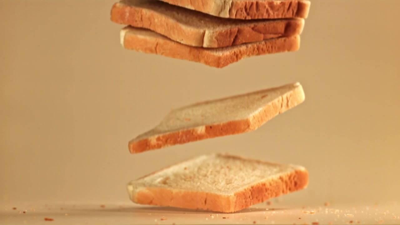 Slow Motion Toasted Bread Slices Falling and Stacking