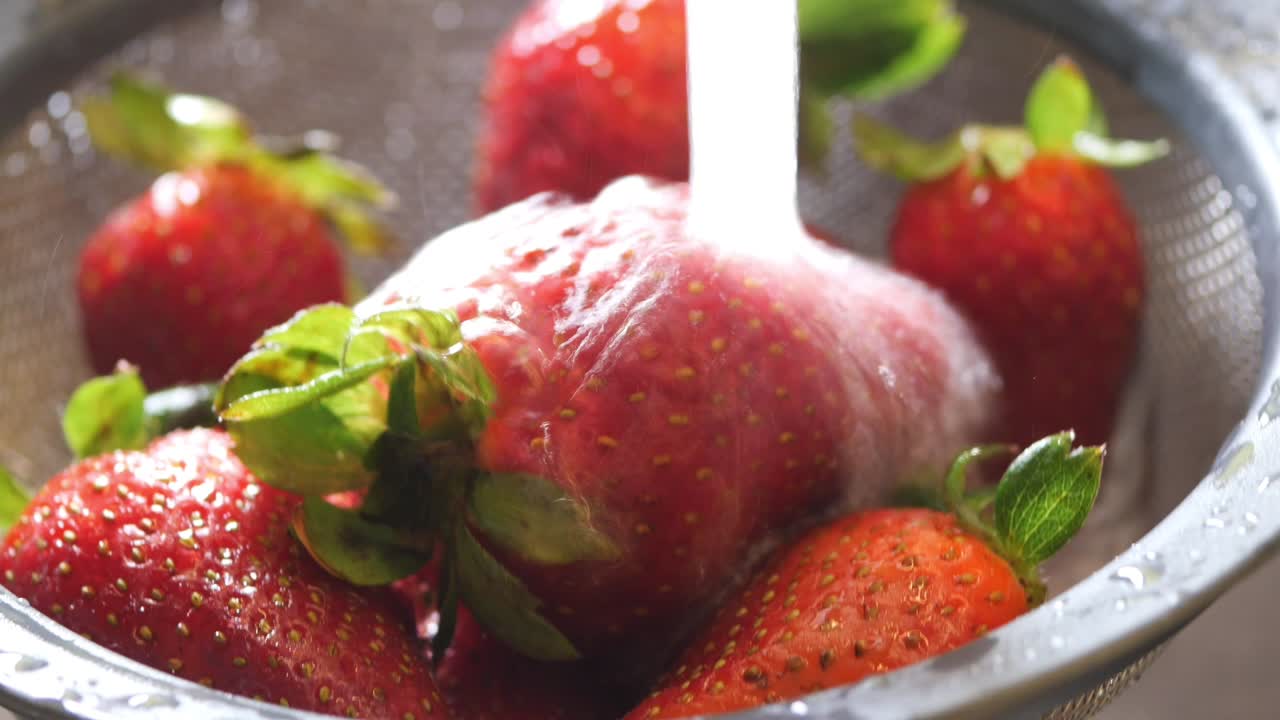 Washing Fresh Strawberries Under Running Water