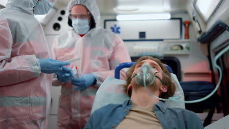 professional doctors making pcr test in ambulance car