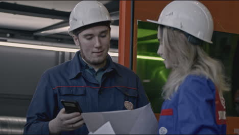 Industrial Workers Reviewing Documents