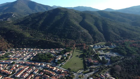 aerial view of a mediterranean town nestled among mountains