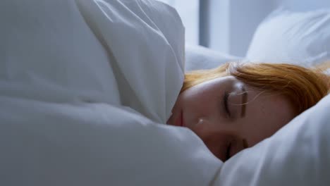 woman sleeping in bedroom at home 4k