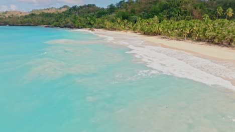 Aerial-forward-over-turquoise-waters-of-Playa-Breman-wilderness-beach-in-Dominican-Republic