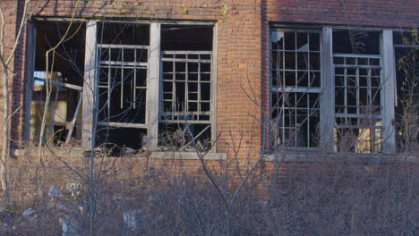 broken windows in an abandoned factory building in ohio in fall