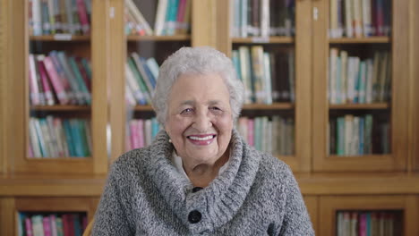 senior, library and old woman with a happy smile