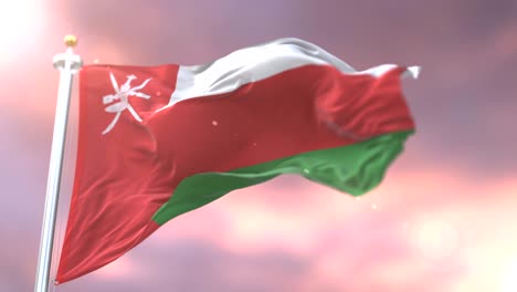 oman flag waving at wind at sunset in slow, loop