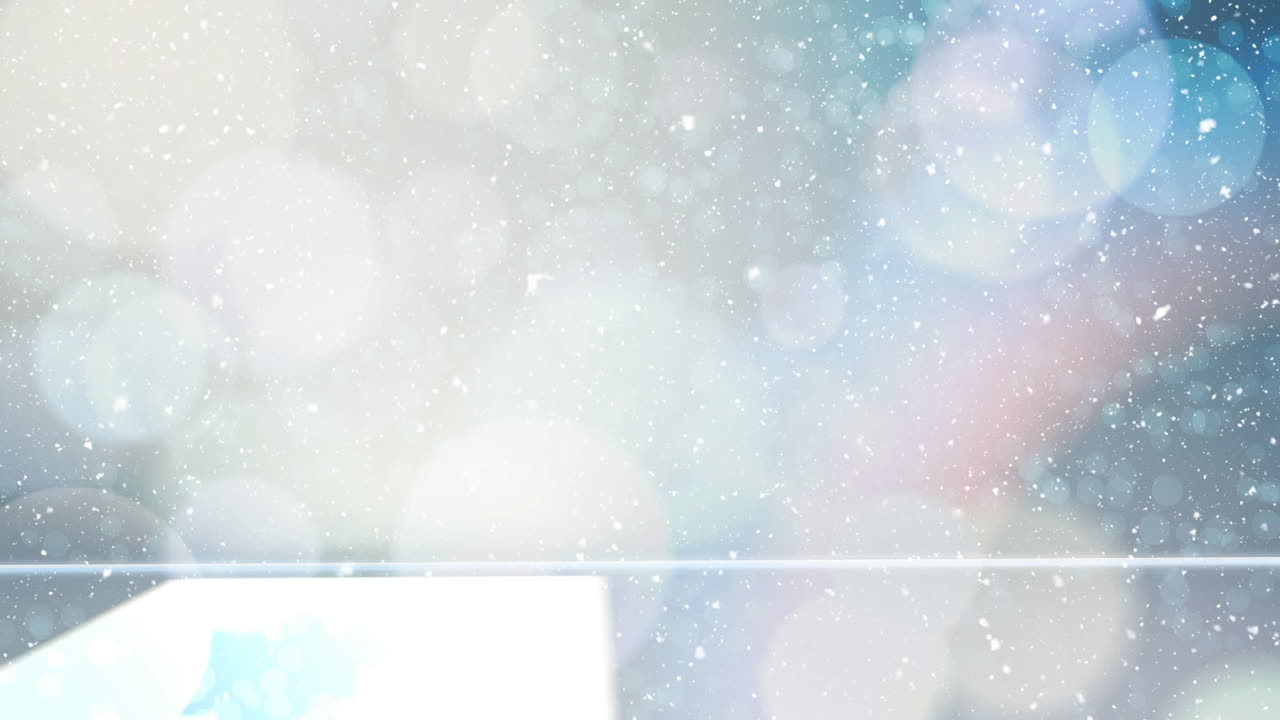 보케 빛의 크리스마스 원과 함께 눈이 내리고 있습니다.