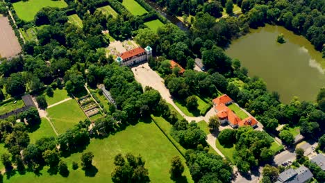 Beautiful-avenue-of-trees-of-Nieborow-Palace,-a-Baroque-style-residence-in-Poland