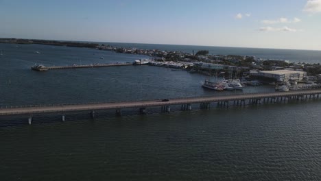 aerial view of bridge by marina in florida