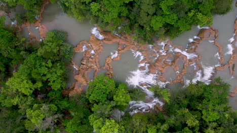 downward angle drone shot of the cascadas de agua azul and the waterfalls found on the xanil river in chiapas mexico