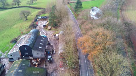 aerial view of an old farm next to a main road