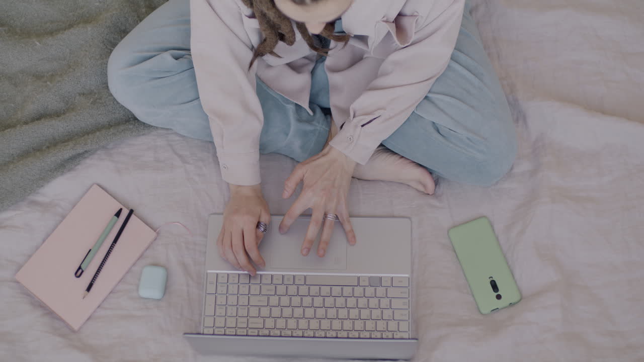 Woman Working Comfortably from Home on Laptop
