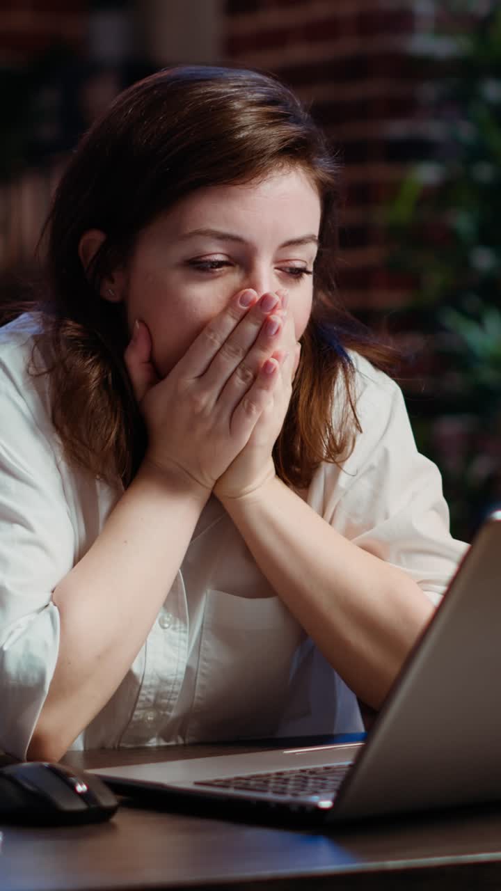 Vertical video Businesswoman working overtime for company project, doing tasks in office
