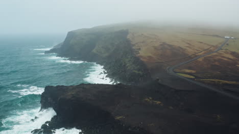 dramatic aerial drone shot over icelandic coastline