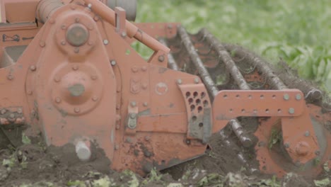 field beng plowed by tractor