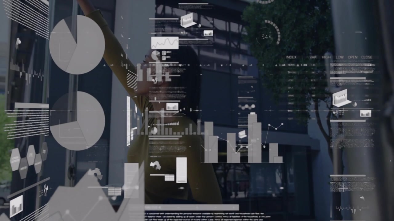 Woman interacting with AR interface in tech workspace, displaying animated charts and graphs