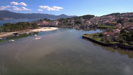 Aerial-Dolly-Back-Over-Esteiro-Bay-With-Boats-Moored