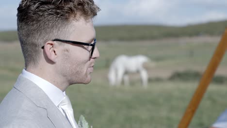 Groom-saying-"I-do"-at-outdoor-backyard-wedding-ceremony