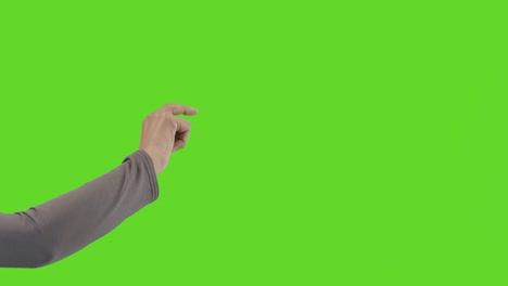 studio close up shot of woman pretending to tap and swipe controls against green screen