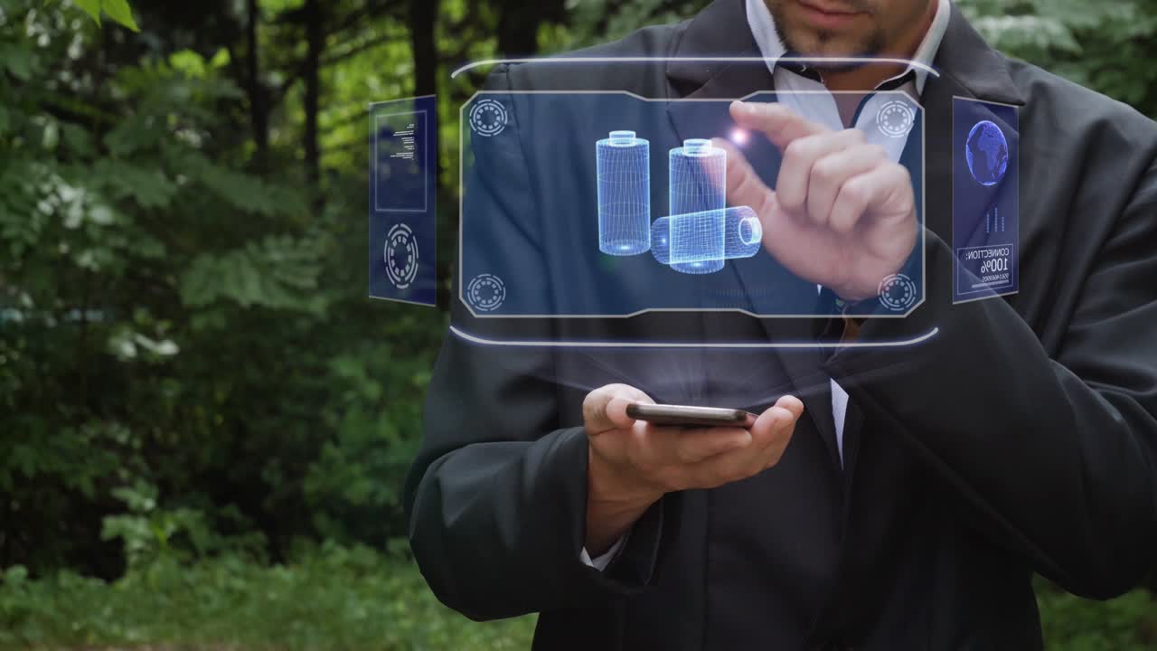 un hombre de negocios usa un holograma con baterías recargables.
