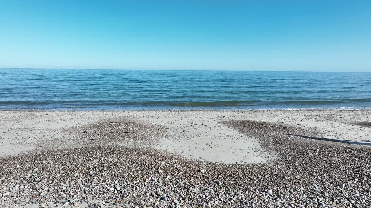 Serene Beach Landscape with Calm Ocean and Blue Sky
