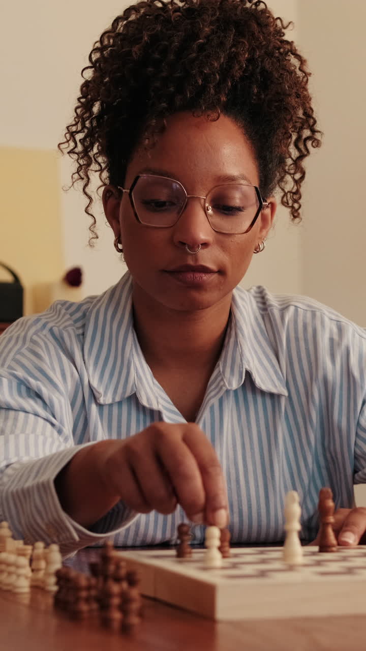 Woman Playing Chess at Home