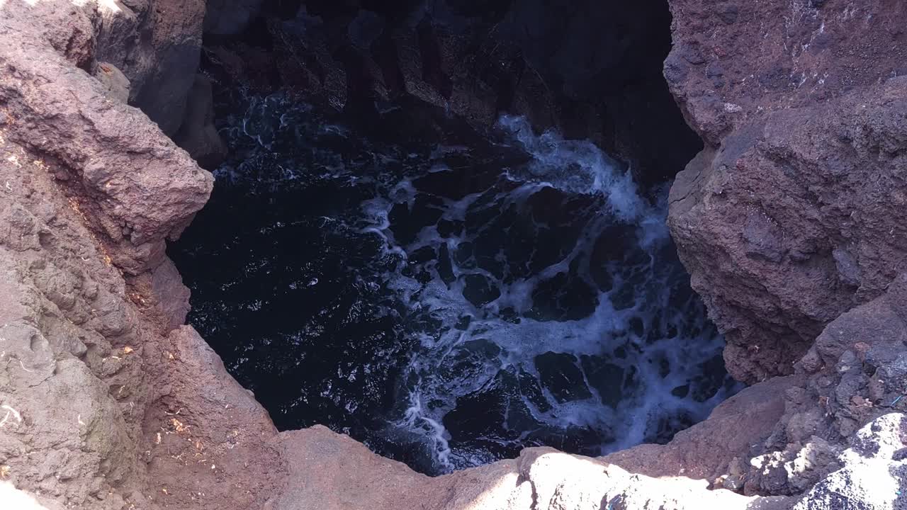 Waves Crashing into a Coastal Rock Hole