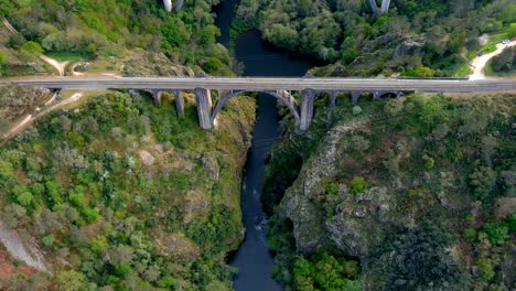 aerial birds eye view over gundian bridge spanning ulla river