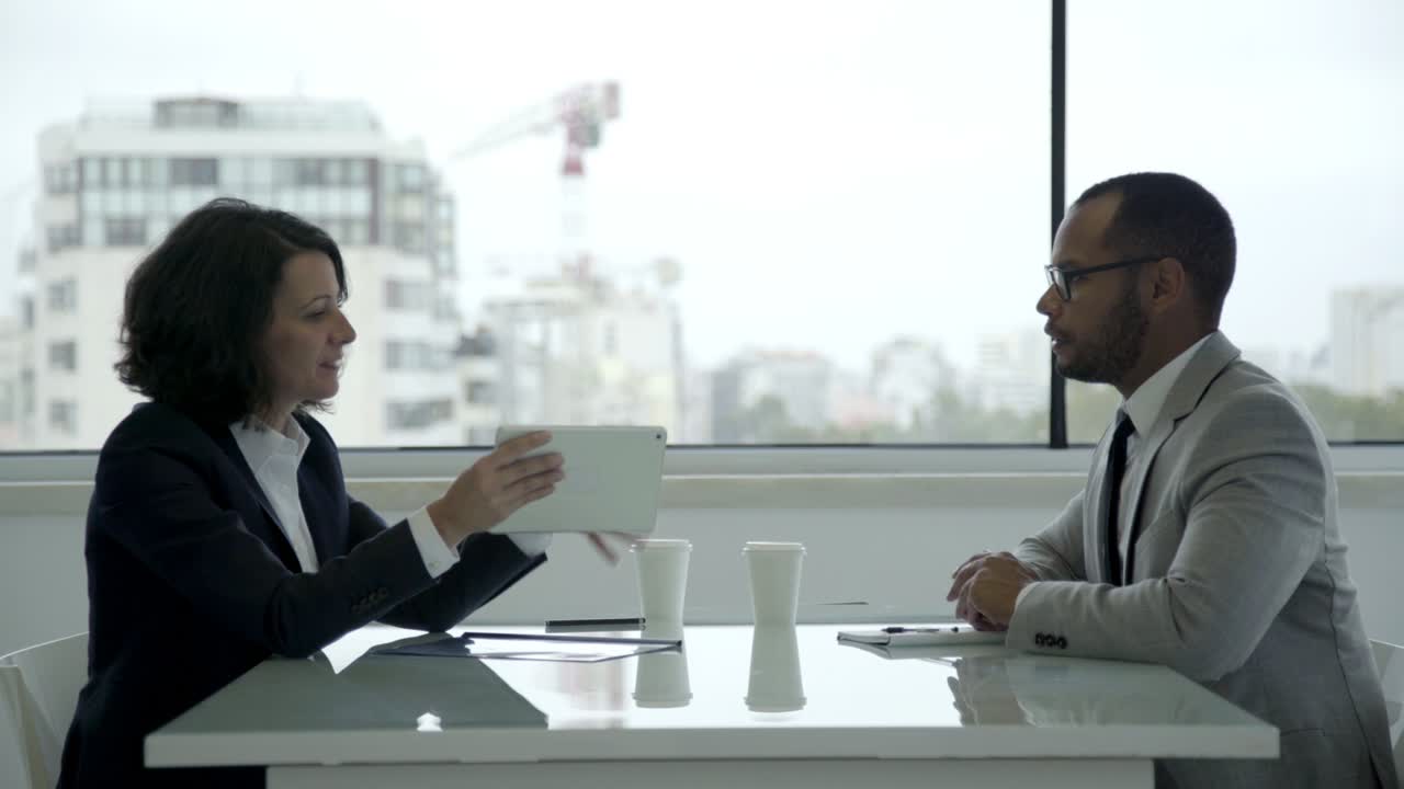 Business consultant talking with client in office