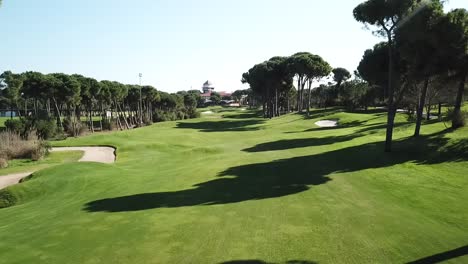 Low-altitude-flying-over-luxury-and-vivid-golf-course-field-in-Turkey