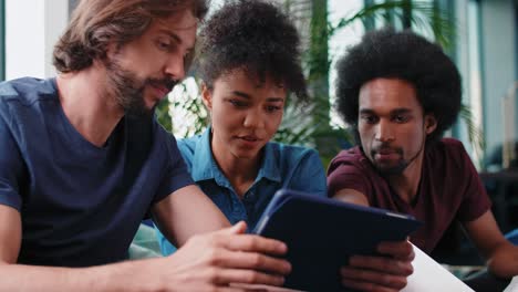 Young-adult-colleagues-working-with-technology