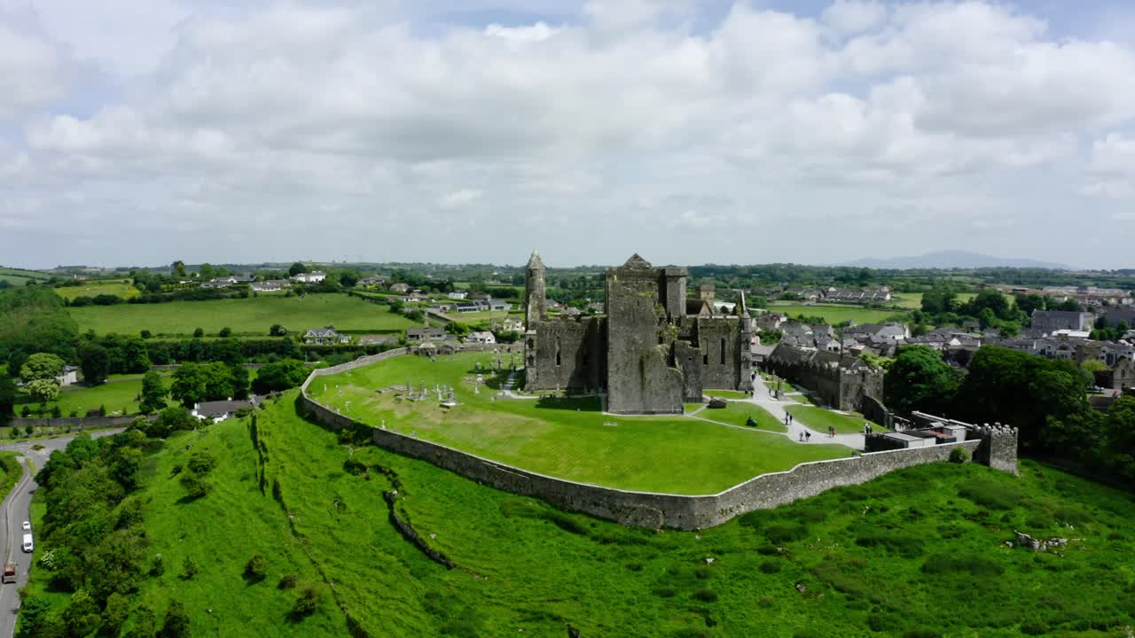 Orbiting shot of a castle in Ireland's rural farmland.