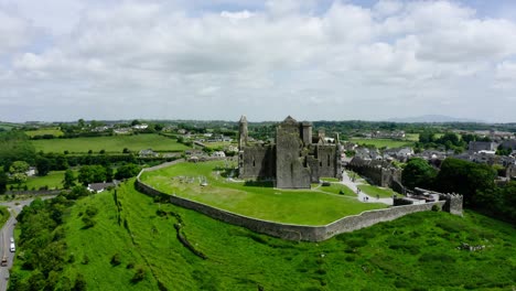 orbiting shot of a castle in ireland's rural farmland.