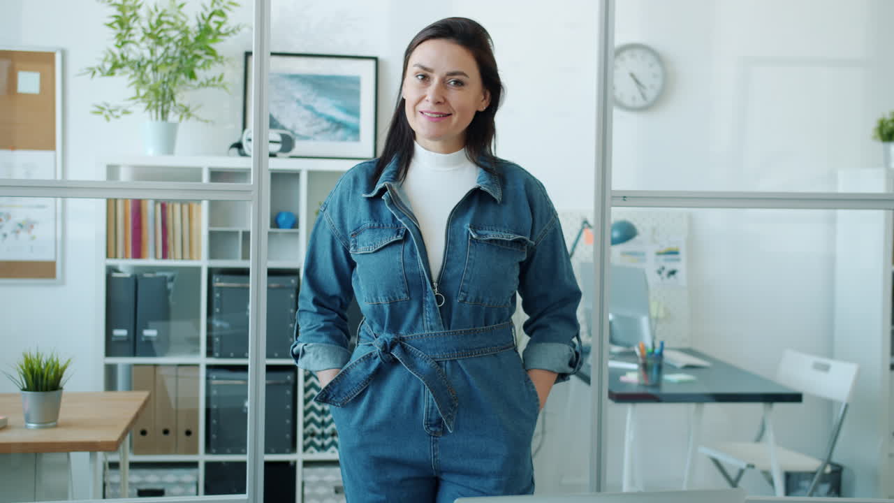 Woman in Denim Jumpsuit in Modern Office