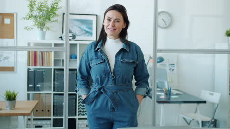 woman in denim jumpsuit in modern office